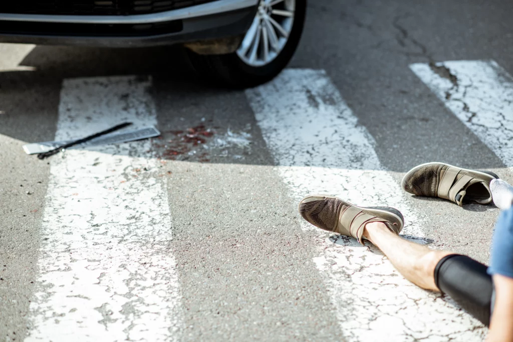 Car stopped at a pedestrian crosswalk after a collision with a pedestrian, illustrating pedestrian accident incidents and legal rights after being hit by a vehicle in Alabama.