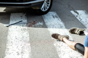 Car stopped at a pedestrian crosswalk after a collision with a pedestrian, illustrating pedestrian accident incidents and legal rights after being hit by a vehicle in Alabama.
